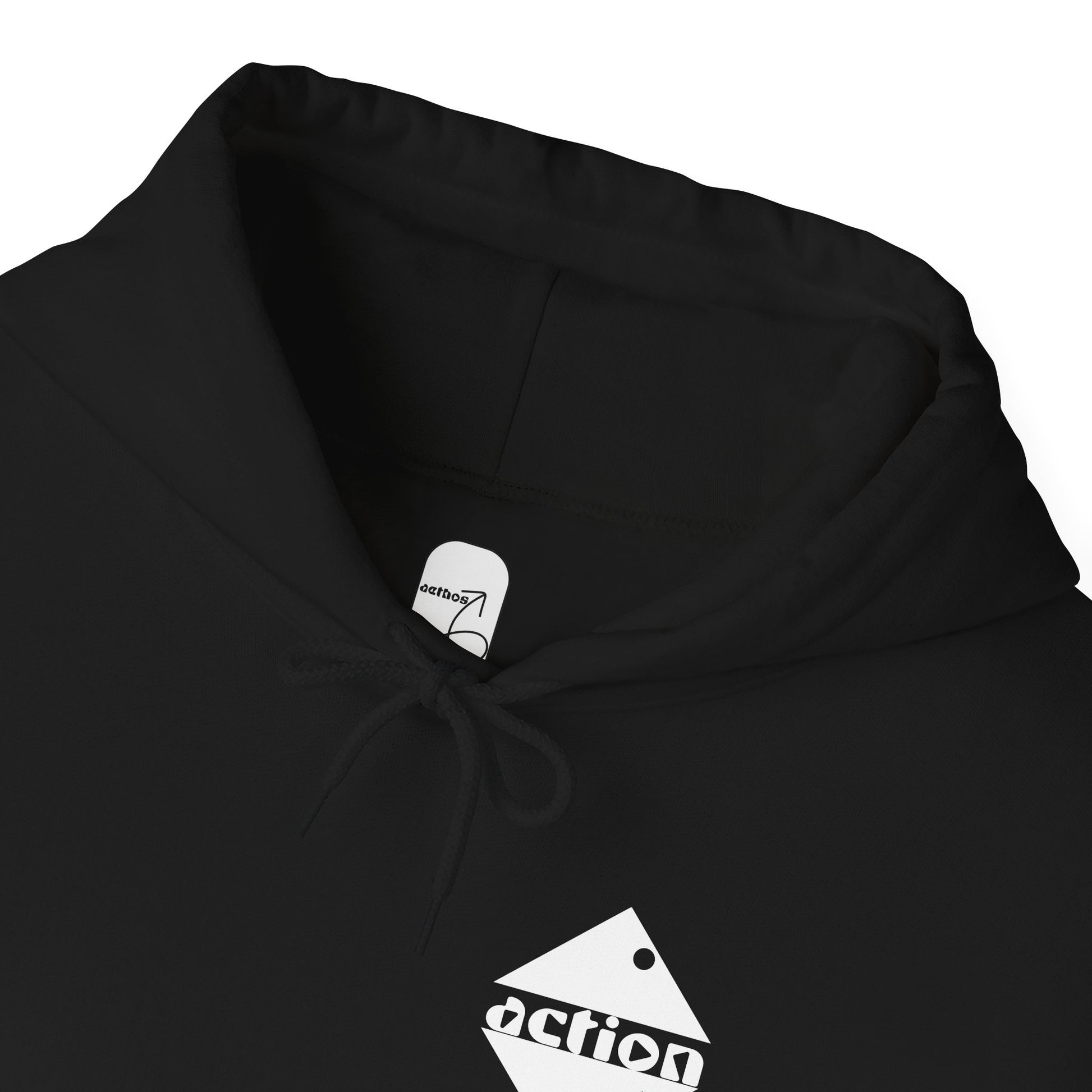 A close-up detail view of the collar and label of the black action hoodie showing the aethos logo on the inside collar. 