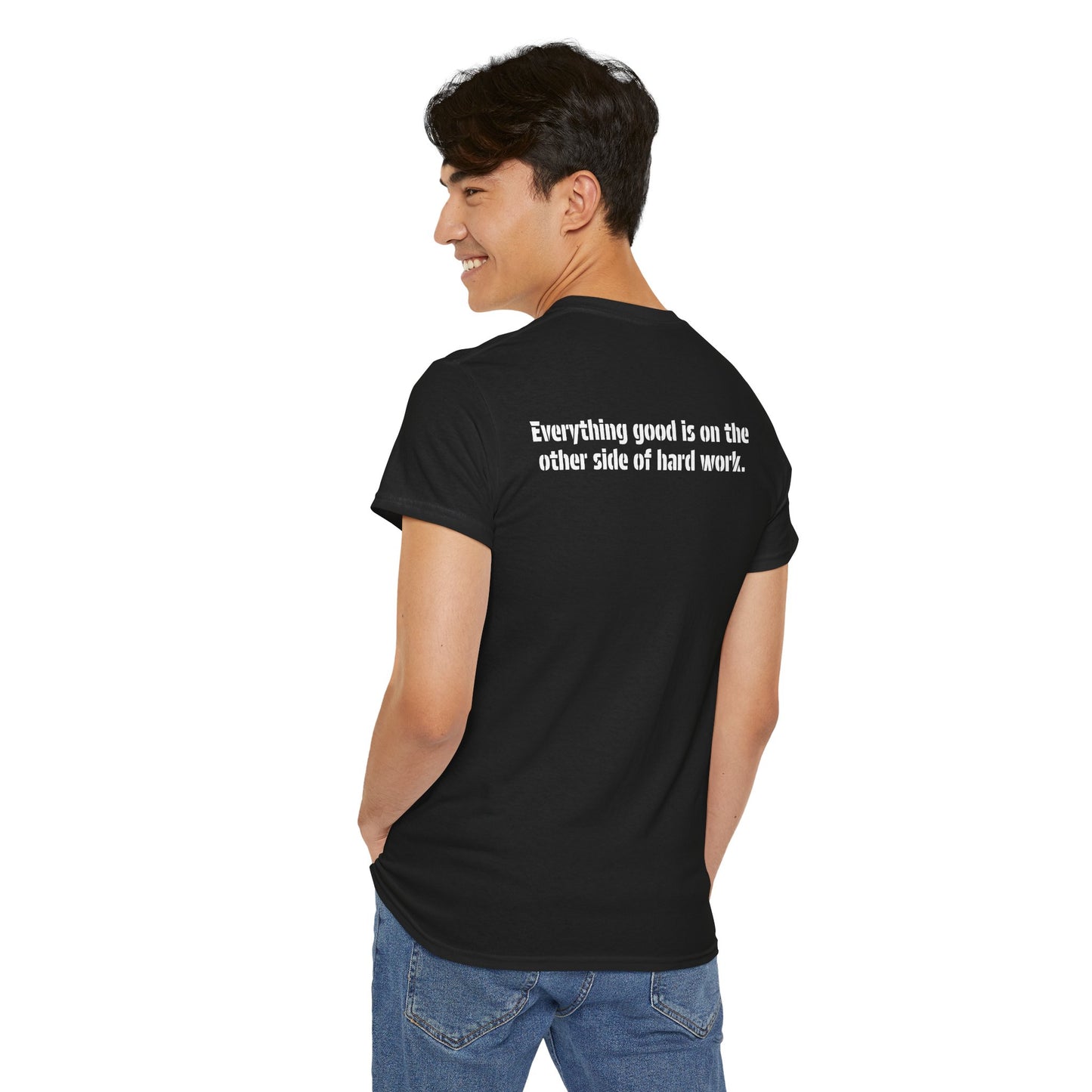 A male model wearing the black action t-shirt showing the back and the inspirational message, "Everything good is on the other side of hard work."