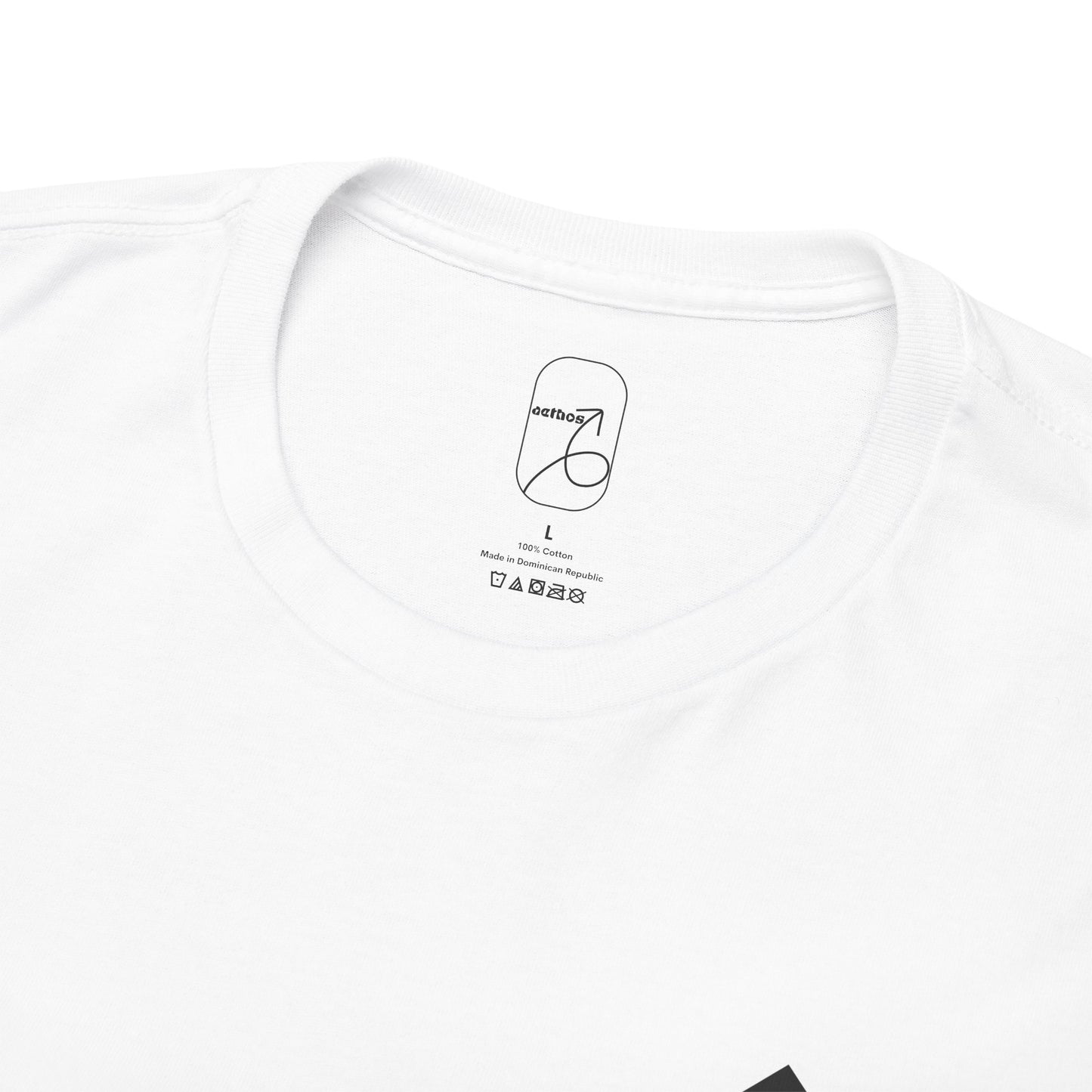 A detailed close-up of the collar label with the aethos logo and item care instructions. 