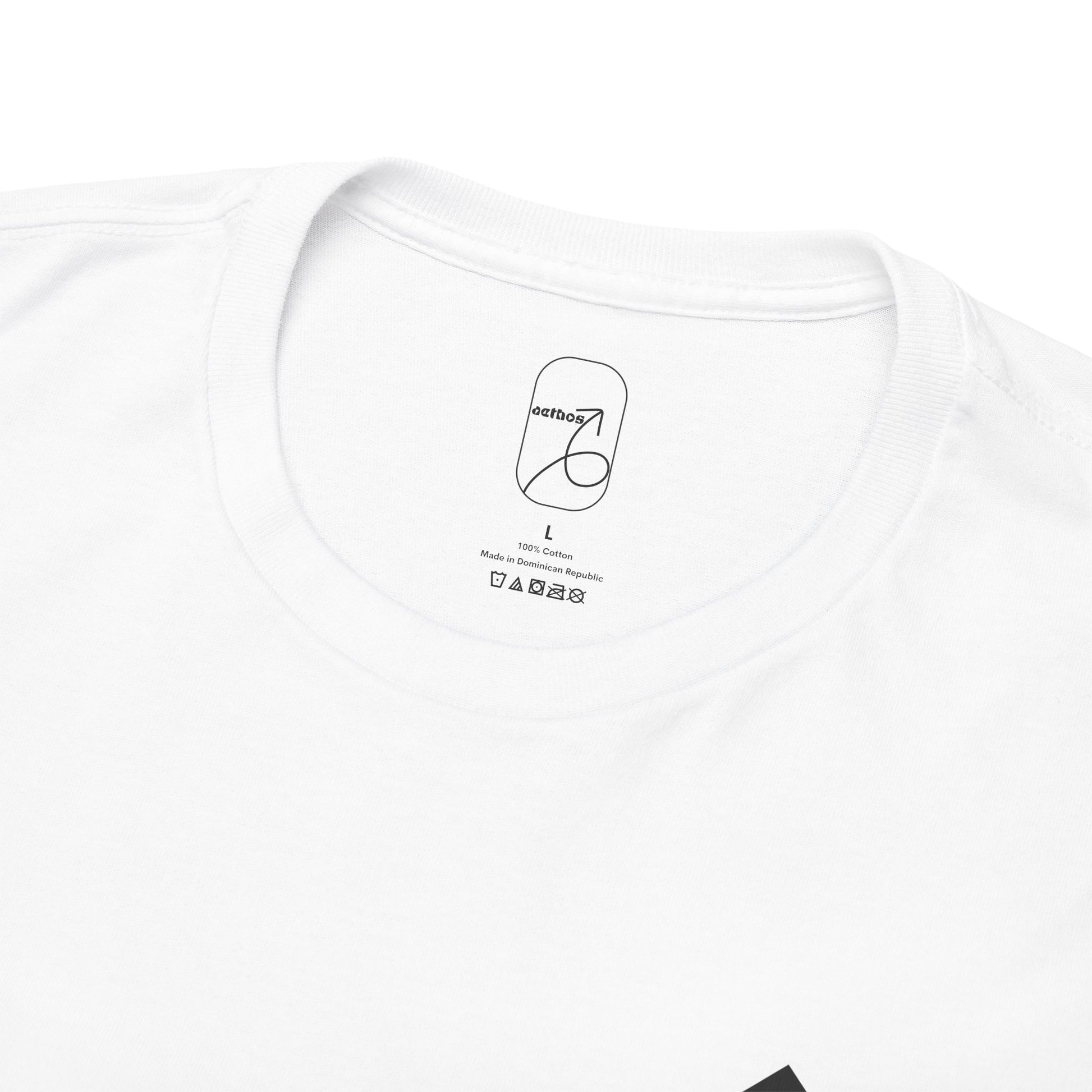 A detailed close-up of the collar label with the aethos logo and item care instructions. 